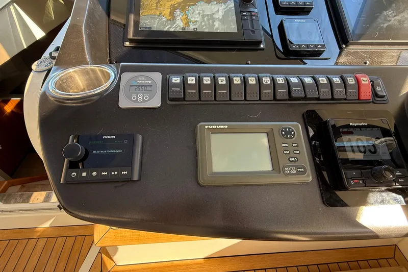 Helios Yacht Photos Pics Control panel of a 2010 Sunseeker Predator 60 yacht with navigation and audio systems.