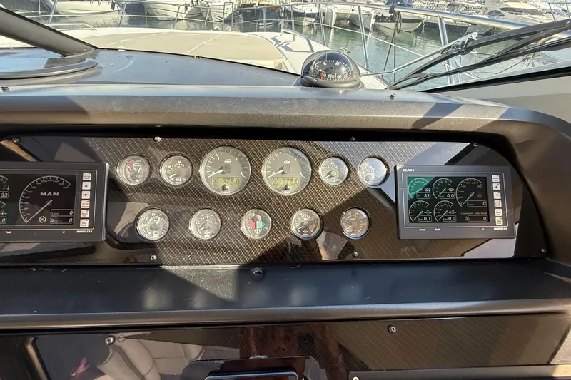 Helios Yacht Photos Pics Control panel of a 2010 Sunseeker Predator 60 yacht with gauges and displays.
