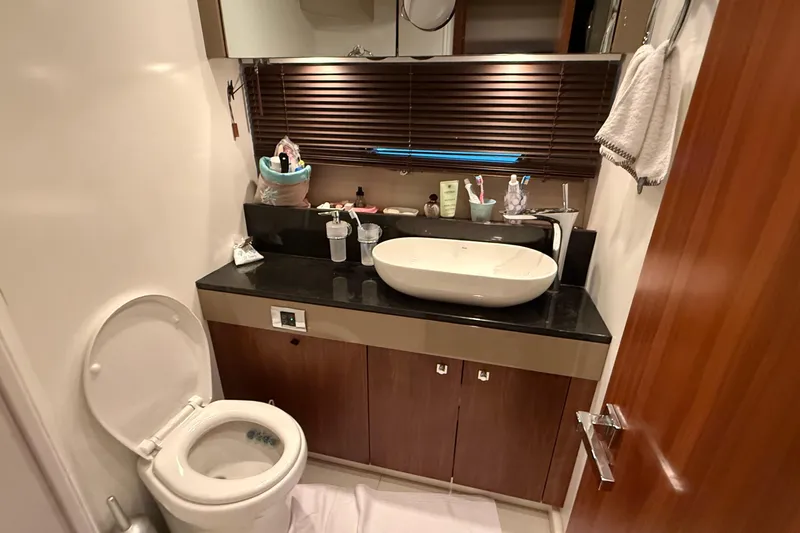 Helios Yacht Photos Pics Bathroom interior of 2010 Sunseeker Predator 60 yacht with modern sink and toilet.