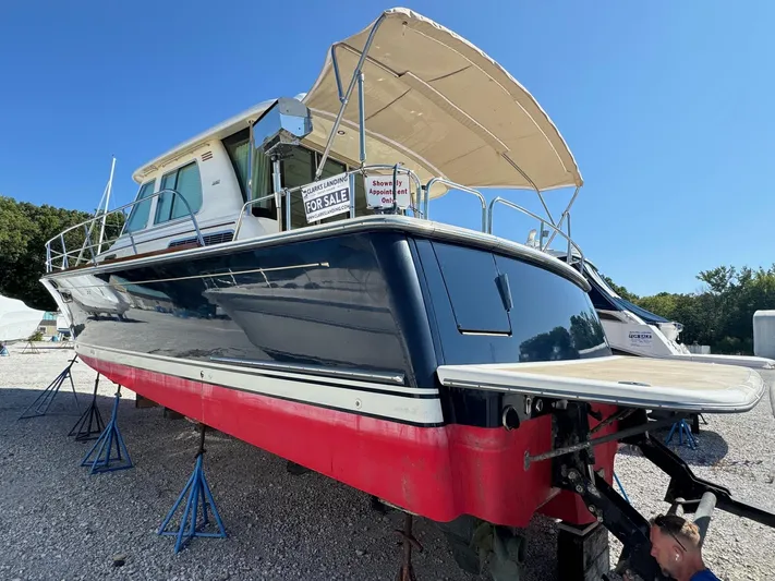  Yacht Photos Pics 2012 Sabre 48 Salon Express boat for sale, displayed on stands, with a canopy.