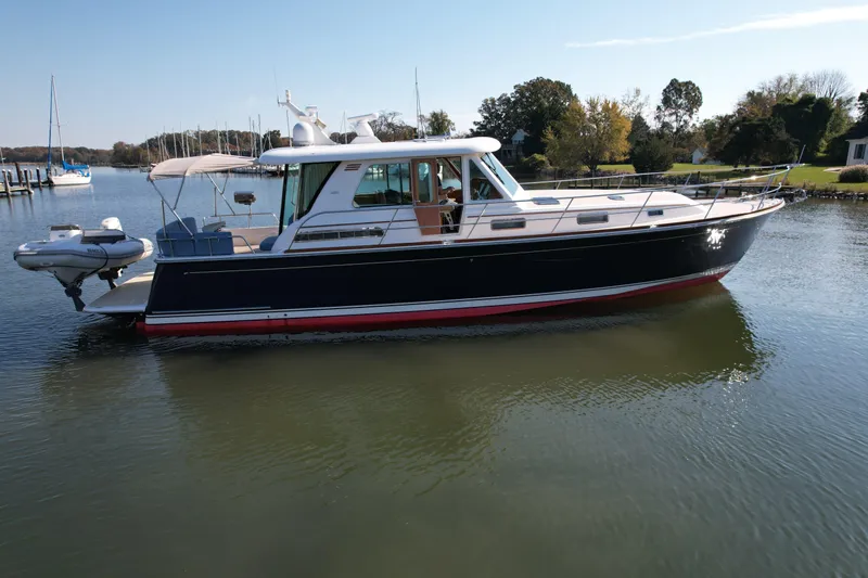  Yacht Photos Pics 2012 Sabre 48 Salon Express yacht on calm water, side view.