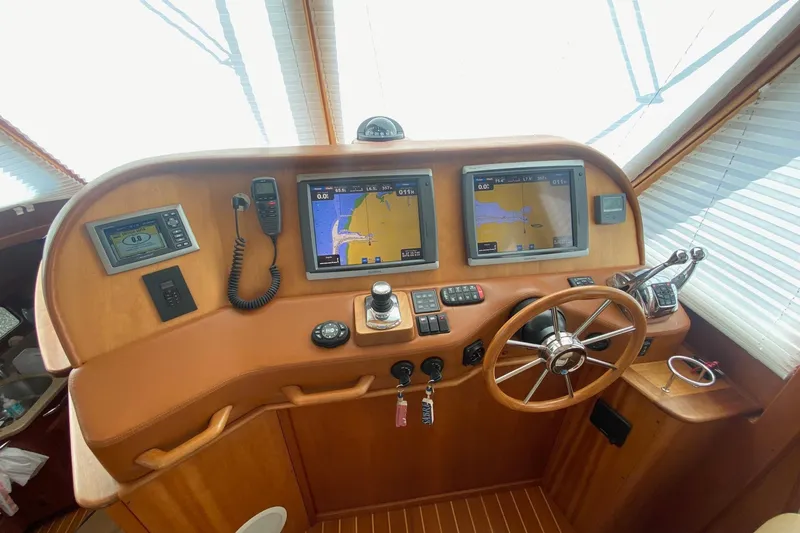  Yacht Photos Pics 2012 Sabre 48 Salon Express helm with navigation screens and steering wheel.