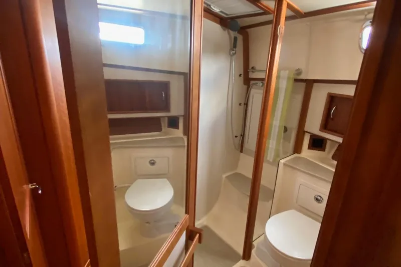  Yacht Photos Pics Luxurious bathroom in 2012 Sabre 48 Salon Express yacht with wood accents.