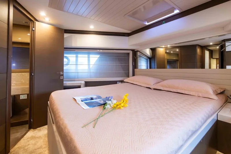  Yacht Photos Pics Luxurious bedroom interior of 2016 Ferretti Yachts 870 with elegant decor and soft lighting.