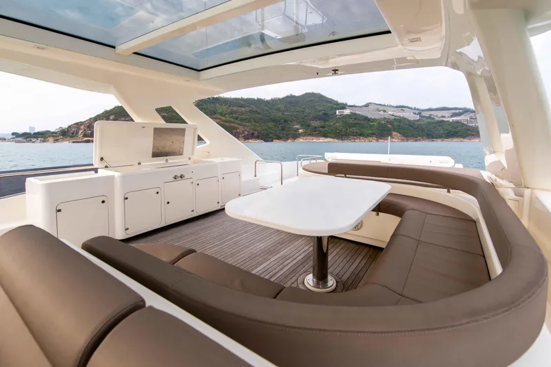  Yacht Photos Pics Luxurious 2016 Ferretti Yachts 870 with elegant outdoor seating and scenic ocean view.