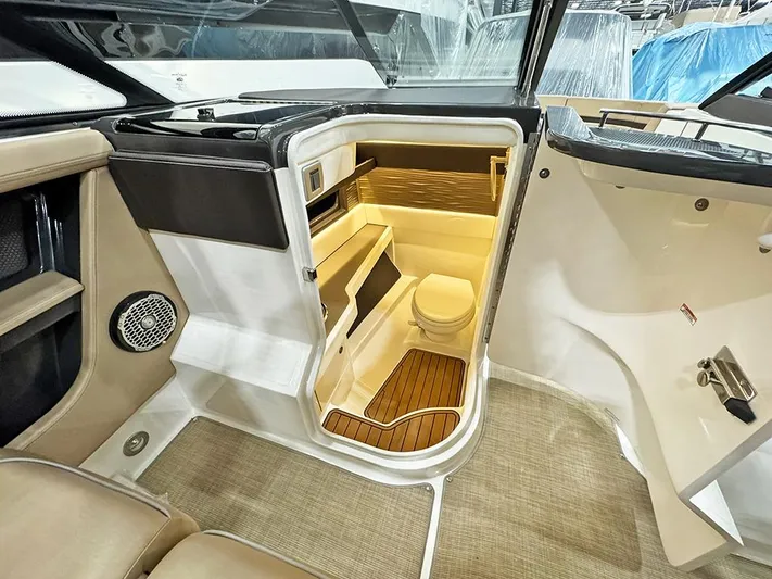  Yacht Photos Pics Interior of 2017 Sea Ray SLX 310 boat featuring a compact bathroom with wooden flooring.