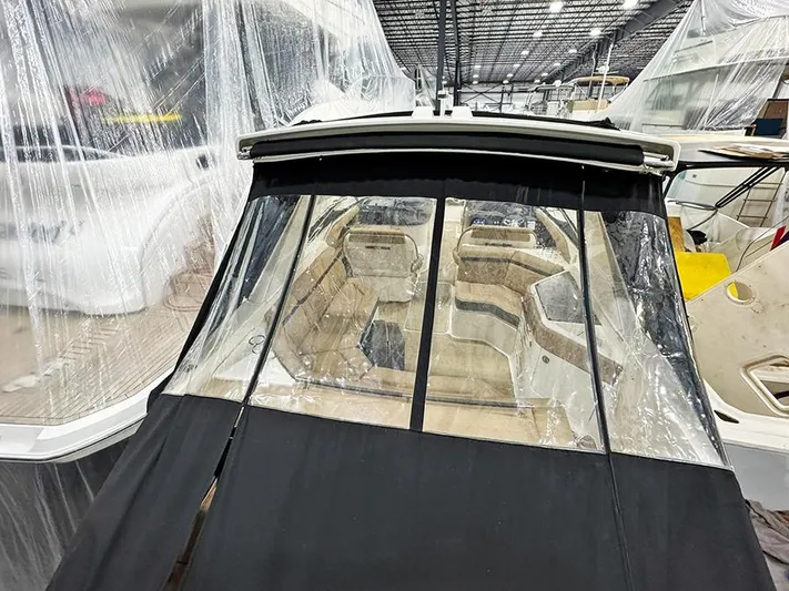  Yacht Photos Pics 2017 Sea Ray SLX 310 boat in storage, covered with protective plastic sheeting.