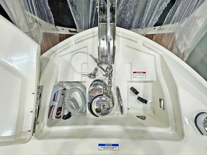  Yacht Photos Pics 2017 Sea Ray SLX 310 anchor compartment with chain, rope, and accessories.