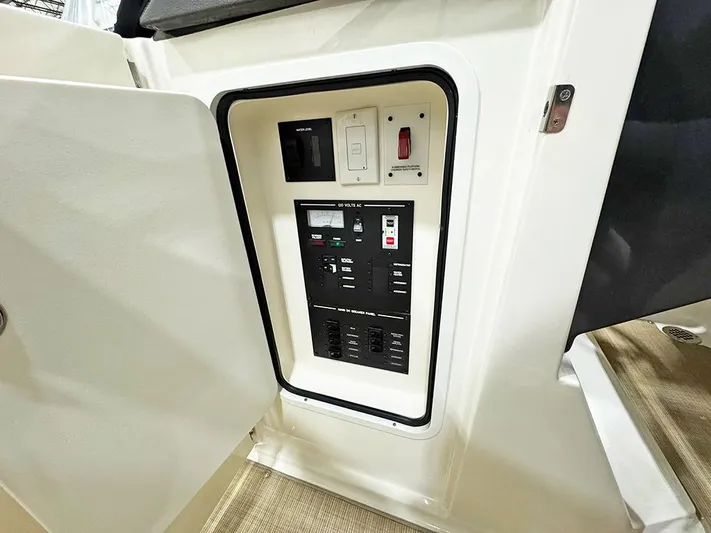  Yacht Photos Pics Electrical panel inside a 2017 Sea Ray SLX 310 boat, featuring switches and controls.