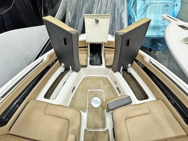  Yacht Photos Pics 2017 Sea Ray SLX 310 boat interior with tan seating and storage compartments.