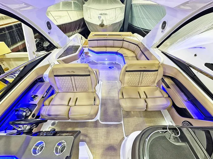  Yacht Photos Pics Luxurious 2017 Sea Ray SLX 310 boat interior with plush seating and ambient lighting.