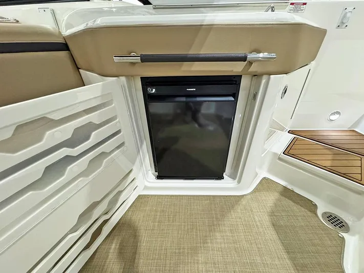  Yacht Photos Pics 2017 Sea Ray SLX 310 boat interior with mini fridge and storage compartments.