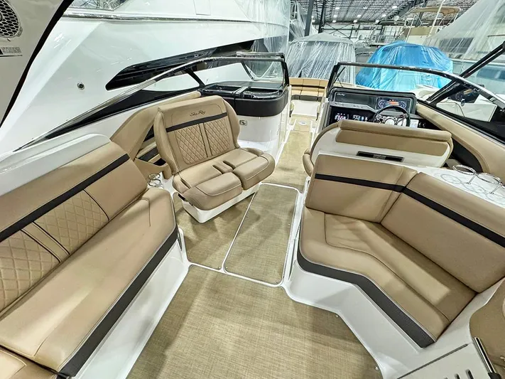  Yacht Photos Pics 2017 Sea Ray SLX 310 boat interior with tan leather seating and modern dashboard.