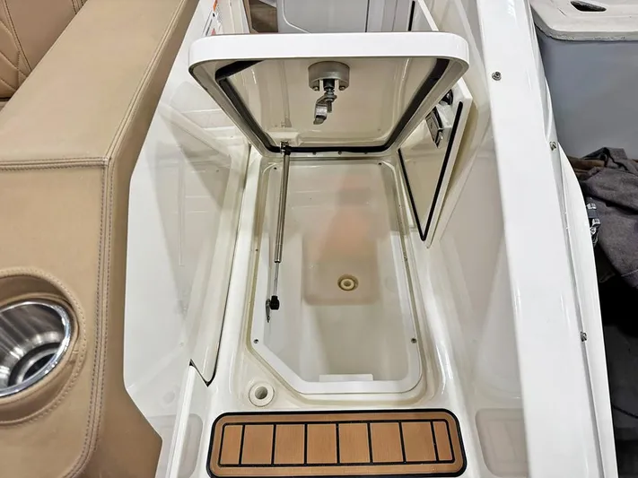  Yacht Photos Pics Open storage compartment on 2017 Sea Ray SLX 310 boat, featuring sleek design and cup holder.