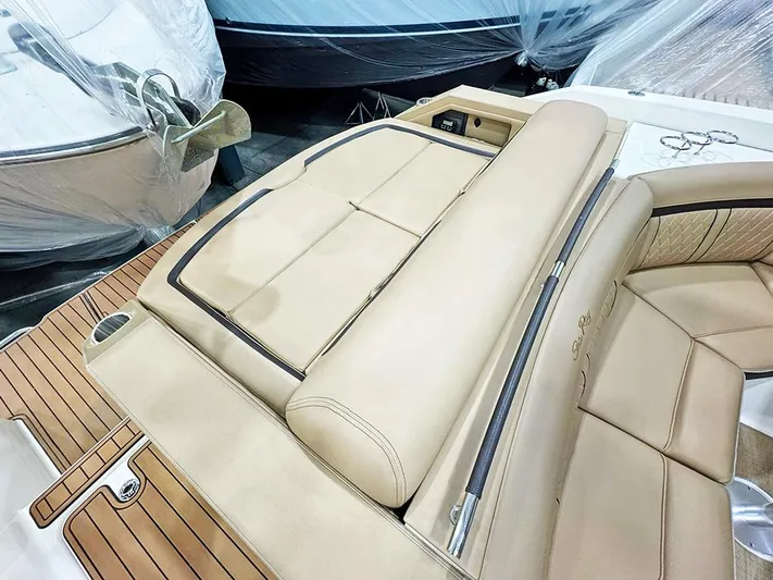  Yacht Photos Pics Luxurious 2017 Sea Ray SLX 310 boat interior with tan leather seating and teak flooring.