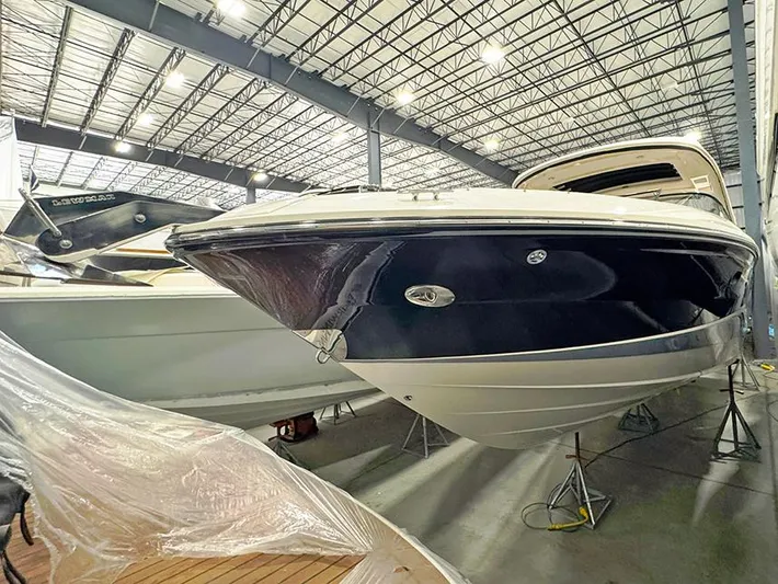  Yacht Photos Pics 2017 Sea Ray SLX 310 boat in indoor storage facility.