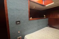 Interior of a 1958 Custom model 22 boat with skylight and mattress.