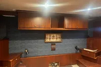 Vintage wooden interior with cabinets, nautical decor, and ambient lighting, Custom model 22, 1958.