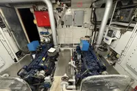 Engine room of a 1958 Custom model 22, featuring dual engines and control panels.