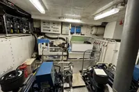 Engine room of a 1958 Custom model 22, featuring machinery and control panels.