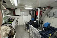 Engine room of a 1958 Custom model 22 boat, featuring machinery and equipment.