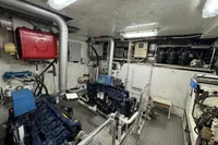 Engine room of a 1958 Custom model 22, featuring machinery and piping systems.