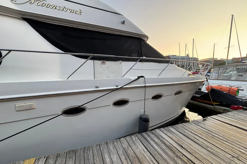 Moonstruck Yacht Photos Pics 1998 Carver 530 Voyager Pilothouse yacht docked at sunset.