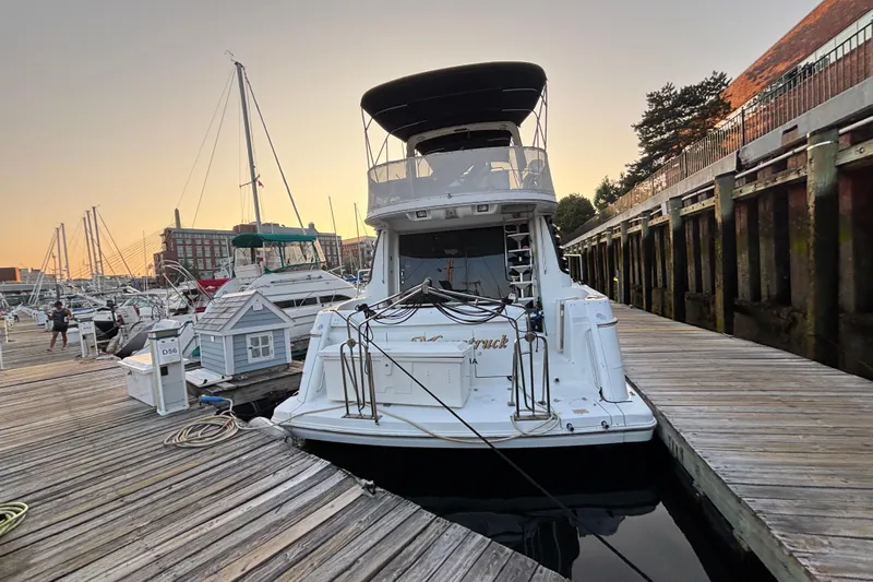 Moonstruck Yacht Photos Pics 1998 Carver 530 Voyager Pilothouse docked at marina during sunset.