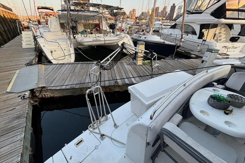 Moonstruck Yacht Photos Pics 1998 Carver 530 Voyager Pilothouse docked at marina with other boats.