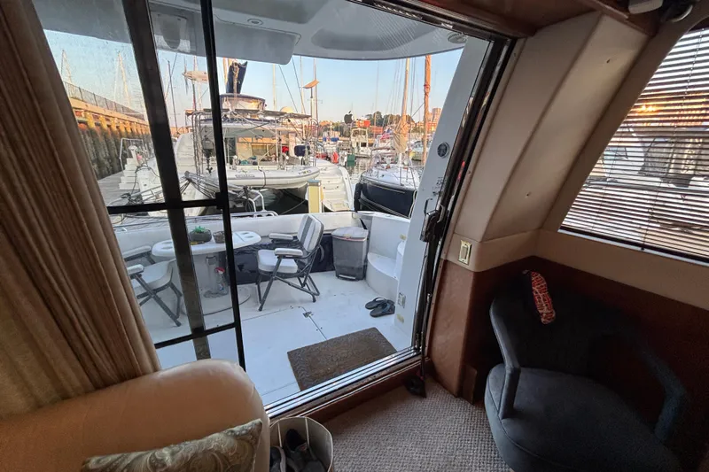 Moonstruck Yacht Photos Pics Interior view of 1998 Carver 530 Voyager Pilothouse yacht with marina backdrop.