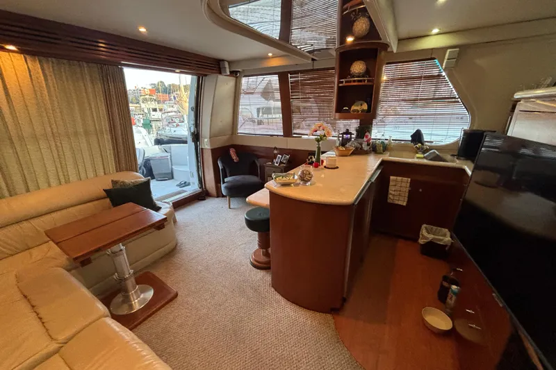 Moonstruck Yacht Photos Pics Luxurious interior of 1998 Carver 530 Voyager Pilothouse yacht with elegant seating and modern amenities.