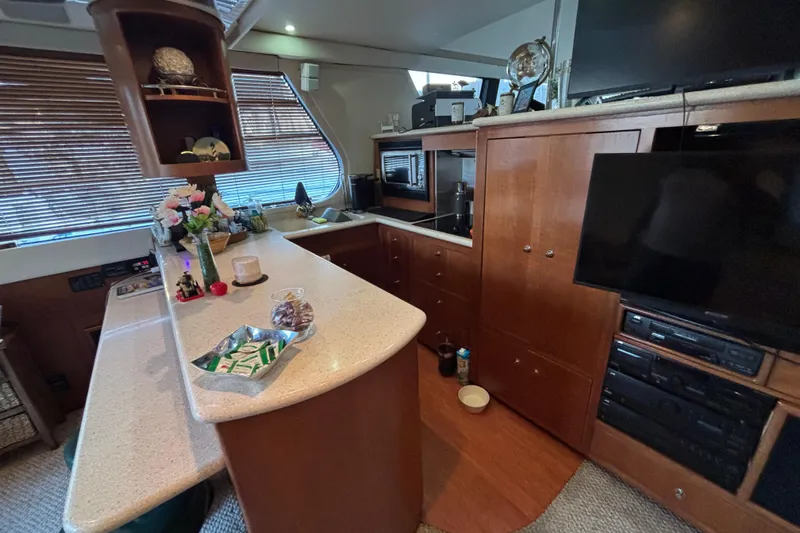 Moonstruck Yacht Photos Pics Luxurious interior of 1998 Carver 530 Voyager Pilothouse with modern amenities.