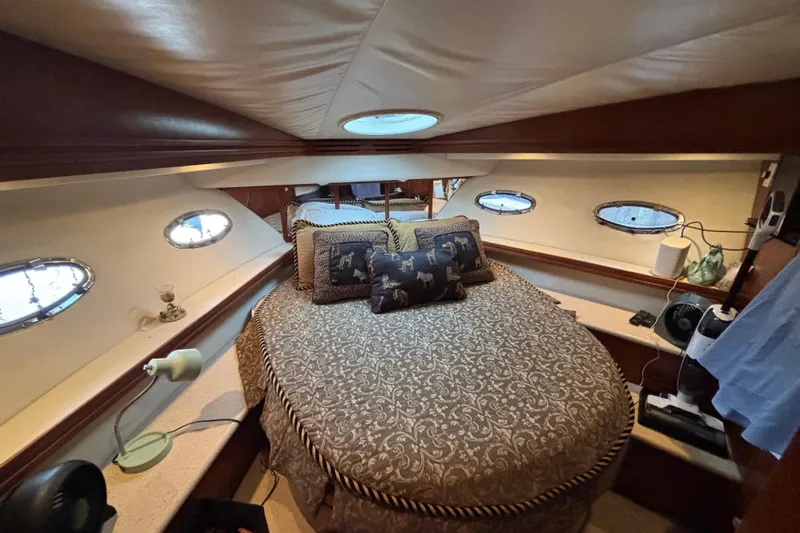 Moonstruck Yacht Photos Pics Luxurious cabin interior of 1998 Carver 530 Voyager Pilothouse yacht with elegant bedding.