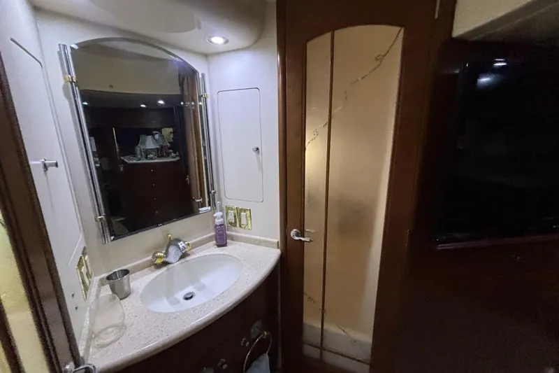 Moonstruck Yacht Photos Pics Bathroom interior of 1998 Carver 530 Voyager Pilothouse yacht with sink and mirror.