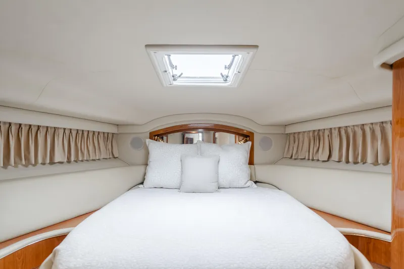 Waterfront Property Yacht Photos Pics Luxurious bedroom interior of 2000 Sea Ray 400 Sedan Bridge yacht.