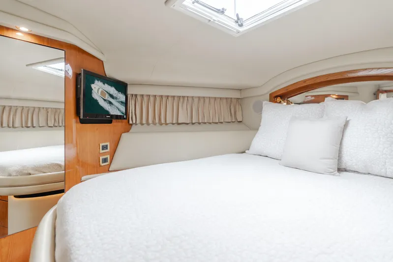 Waterfront Property Yacht Photos Pics Luxurious bedroom interior of 2000 Sea Ray 400 Sedan Bridge yacht.