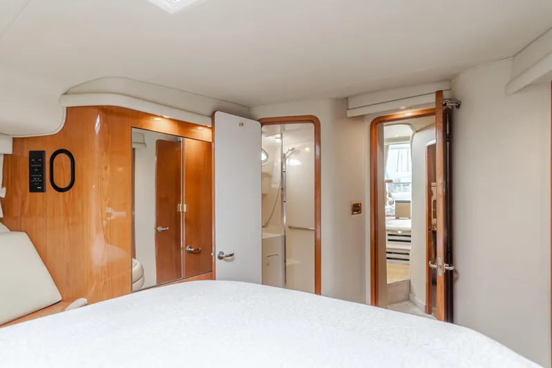 Waterfront Property Yacht Photos Pics Interior cabin of 2000 Sea Ray 400 Sedan Bridge yacht with wooden finishes.