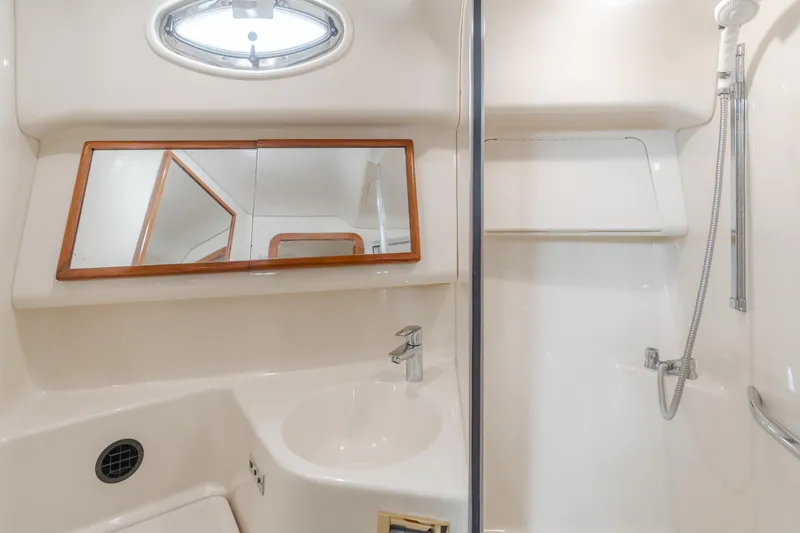 Waterfront Property Yacht Photos Pics Bathroom interior of 2000 Sea Ray 400 Sedan Bridge yacht with sink and shower.