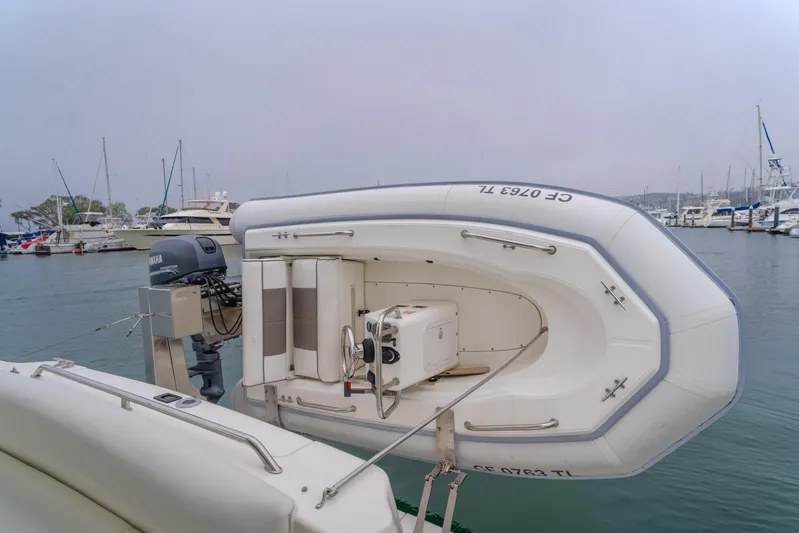 Waterfront Property Yacht Photos Pics Inflatable dinghy on a 2000 Sea Ray 400 Sedan Bridge yacht in a marina.