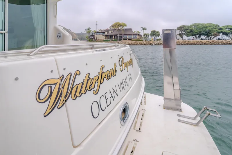 Waterfront Property Yacht Photos Pics Sea Ray 400 Sedan Bridge 2000 yacht docked with Waterfront Property text.