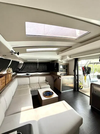  Yacht Photos Pics Interior of 2022 Fountaine Pajot Elba 45 catamaran with modern seating and skylights.