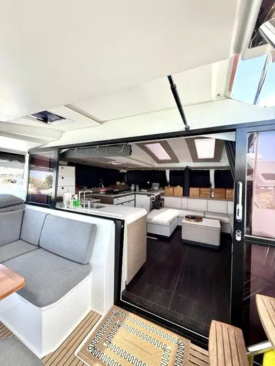  Yacht Photos Pics Modern interior of 2022 Fountaine Pajot Elba 45 catamaran, featuring spacious seating and sleek design.