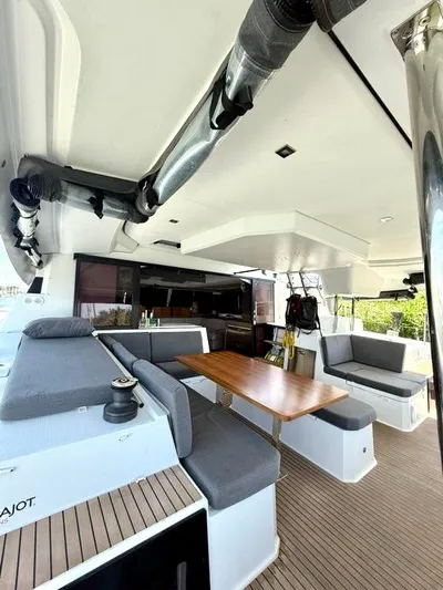  Yacht Photos Pics 2022 Fountaine Pajot Elba 45 yacht with spacious outdoor seating and dining area.