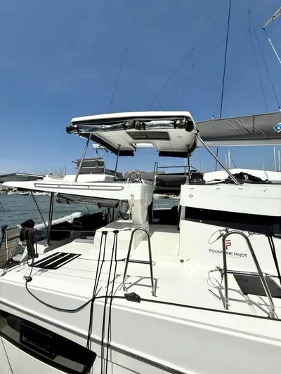  Yacht Photos Pics 2022 Fountaine Pajot Elba 45 catamaran docked, showcasing sleek design and modern features.