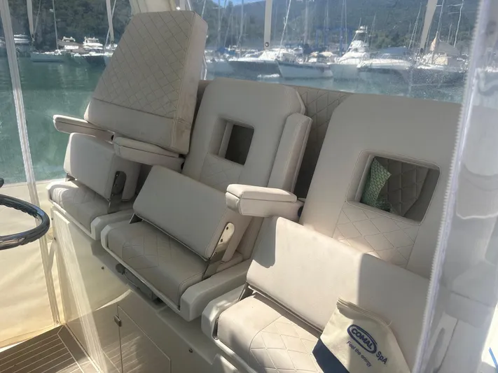  Yacht Photos Pics Luxury seating on 2023 3B Craft 330 CC boat, featuring quilted upholstery.