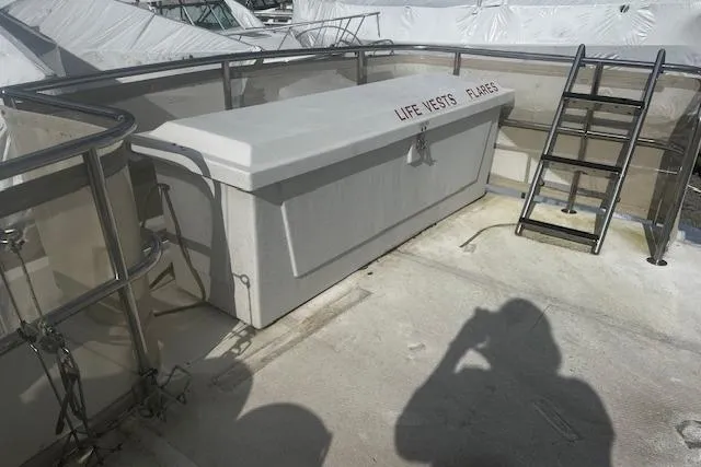 Talisman Yacht Photos Pics 2003 Mainship 430 Aft Cabin Trawler deck with life vests and flares storage.