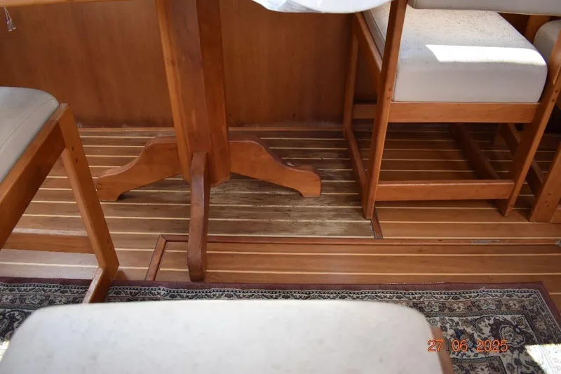 Talisman Yacht Photos Pics Interior of 2003 Mainship 430 Aft Cabin Trawler with wooden flooring and furniture.