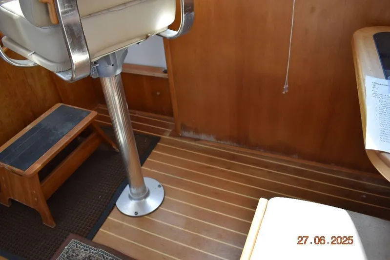 Talisman Yacht Photos Pics Interior of 2003 Mainship 430 Aft Cabin Trawler with wooden flooring and seating.