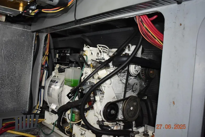 Talisman Yacht Photos Pics Engine compartment of a 2003 Mainship 430 Aft Cabin Trawler with visible wiring and components.