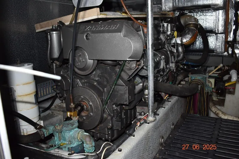 Talisman Yacht Photos Pics Engine room of a 2003 Mainship 430 Aft Cabin Trawler, featuring a Yanmar engine.